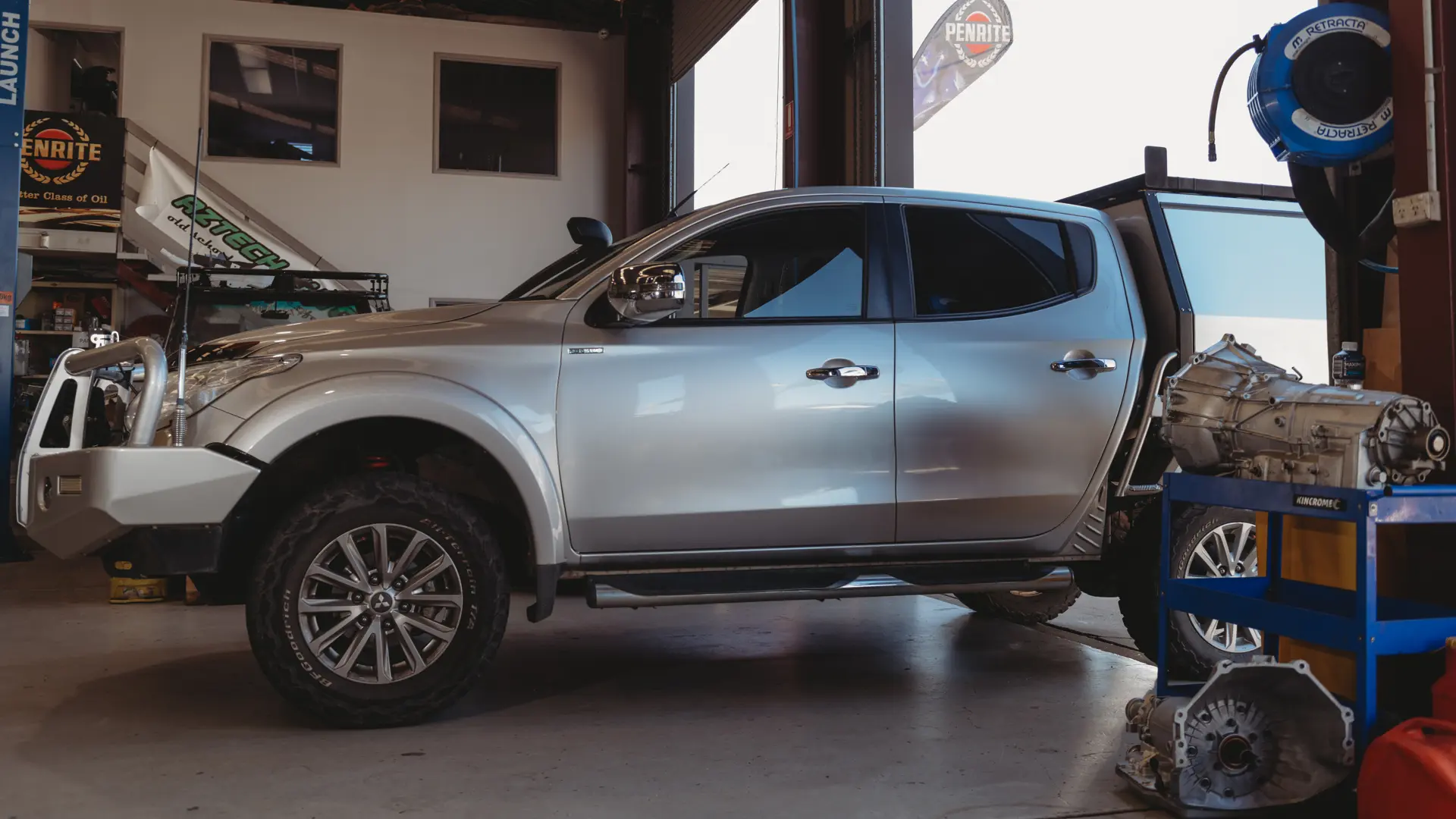 Dual cab ute in the workshop for four wheel drive accessory fitting