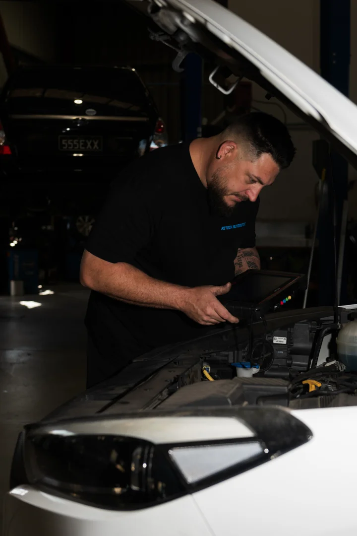 Aztech mechanic checking a vehicle in the Brendale workshop